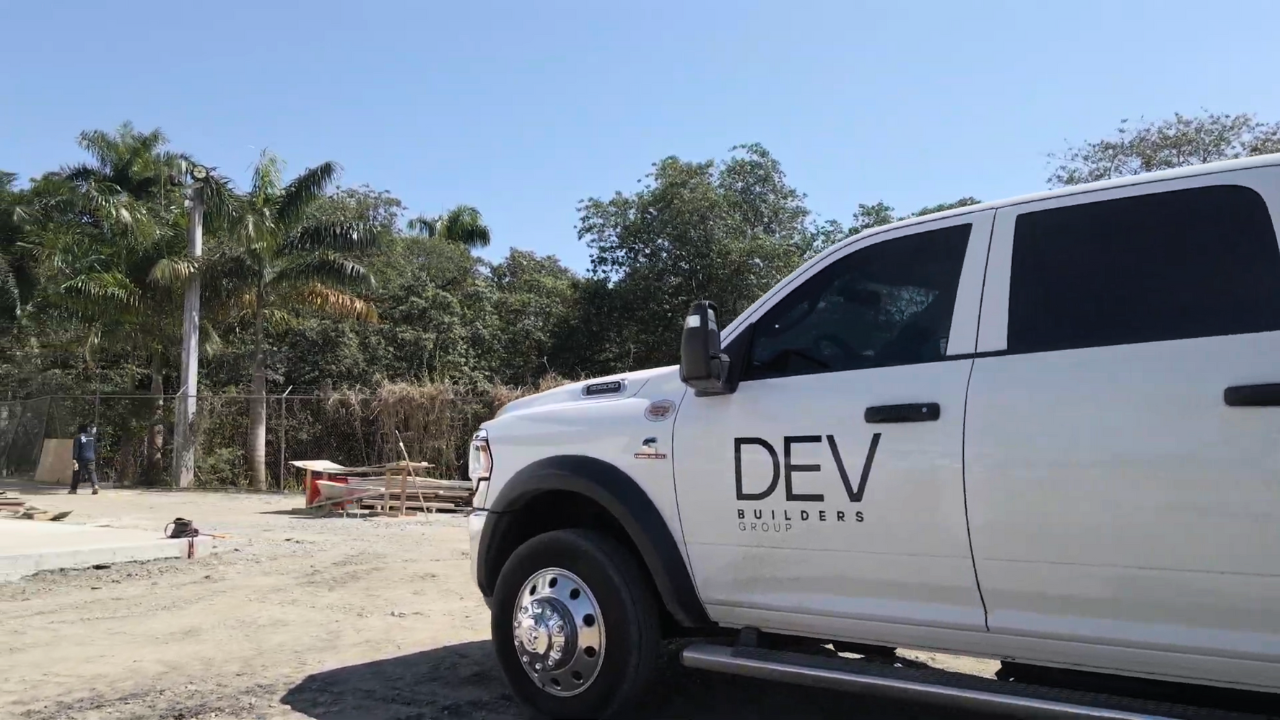 A DEV Builders truck on a construction site