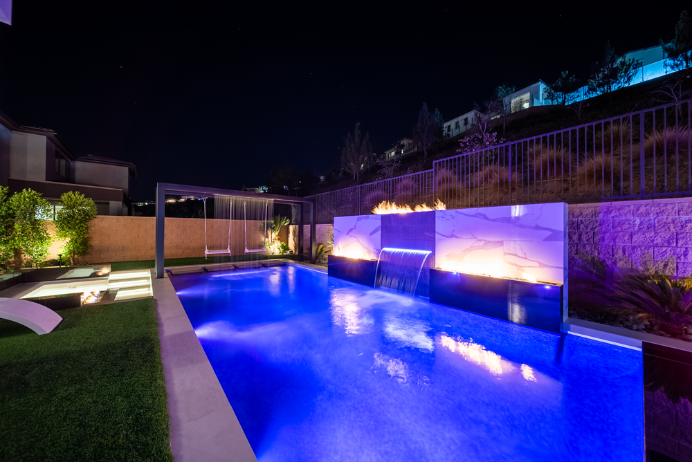 San Juan Capistrano Pool Builder - Custom pool with swing, fire features, and water feature.