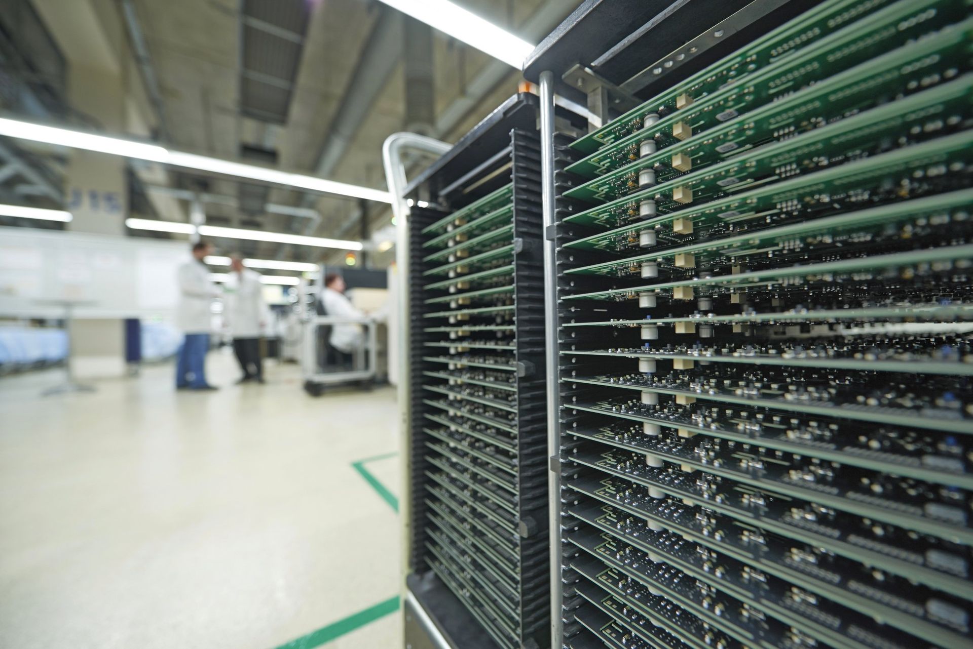 A bunch of electronic components are stacked on top of each other in a factory.