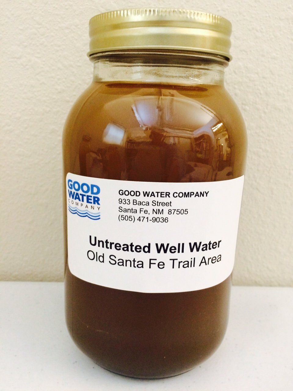 A jar of untreated well water from the good water company