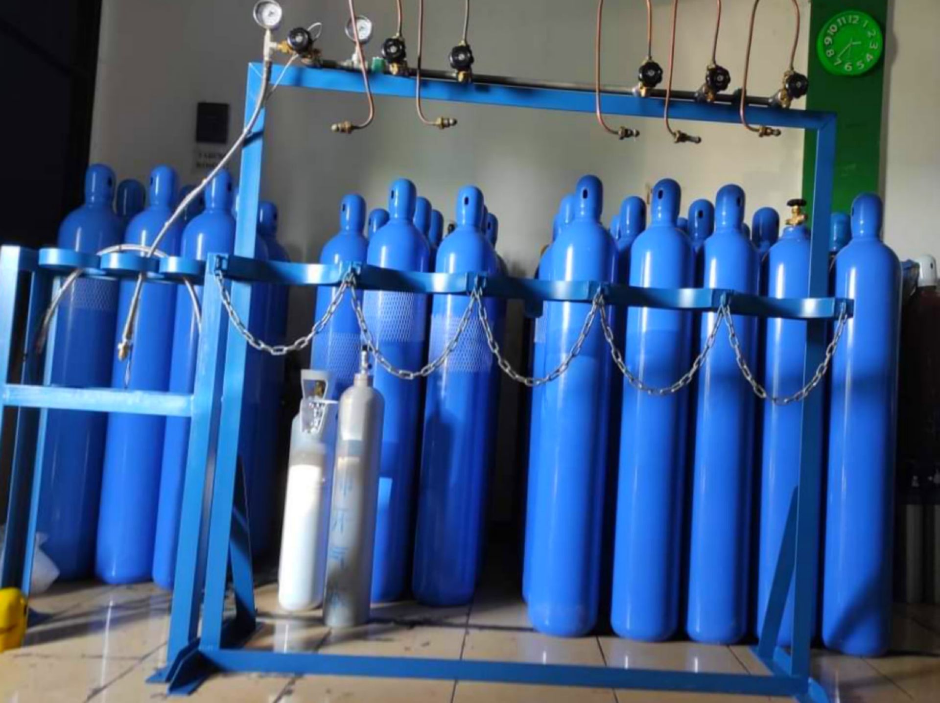 Storage room filled with blue gas cylinders from trusted liquid propane suppliers.