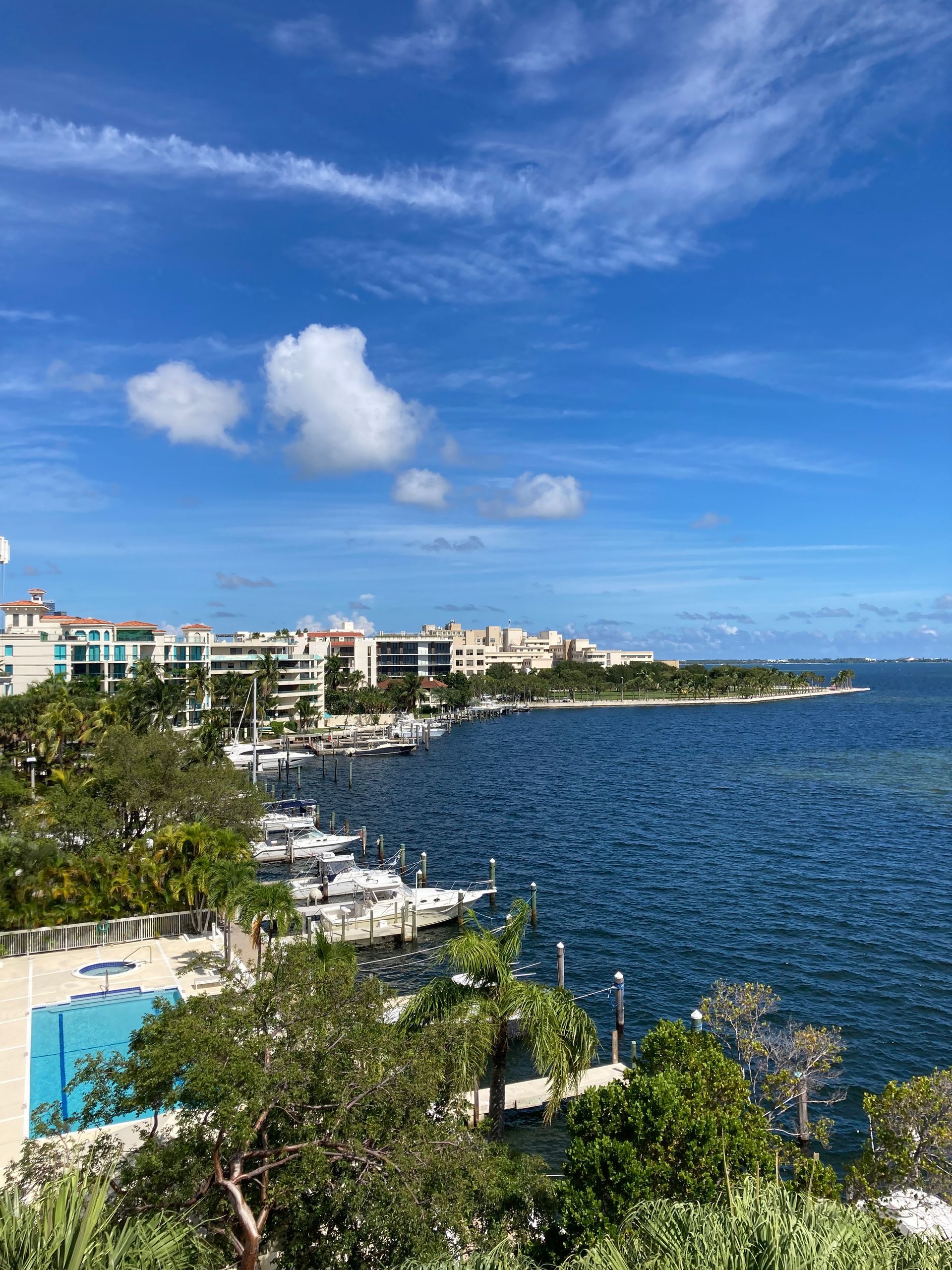 A patio with a lot of furniture and lights at night.