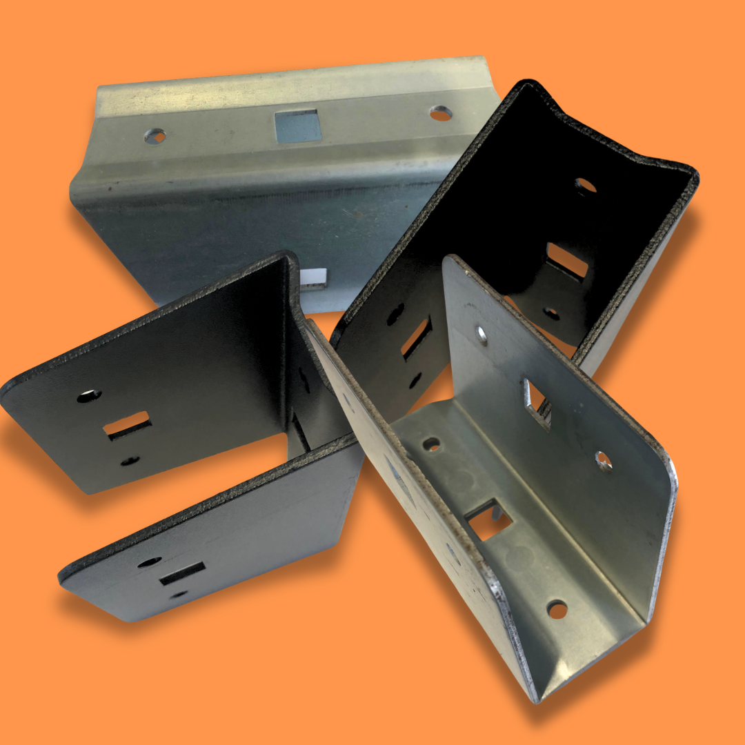 Several metal U-shaped fence rail brackets in black and silver finishes, arranged against an orange background.