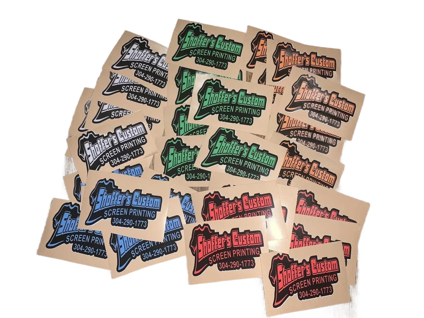 Assorted colorful logo stickers laid out on a light background.