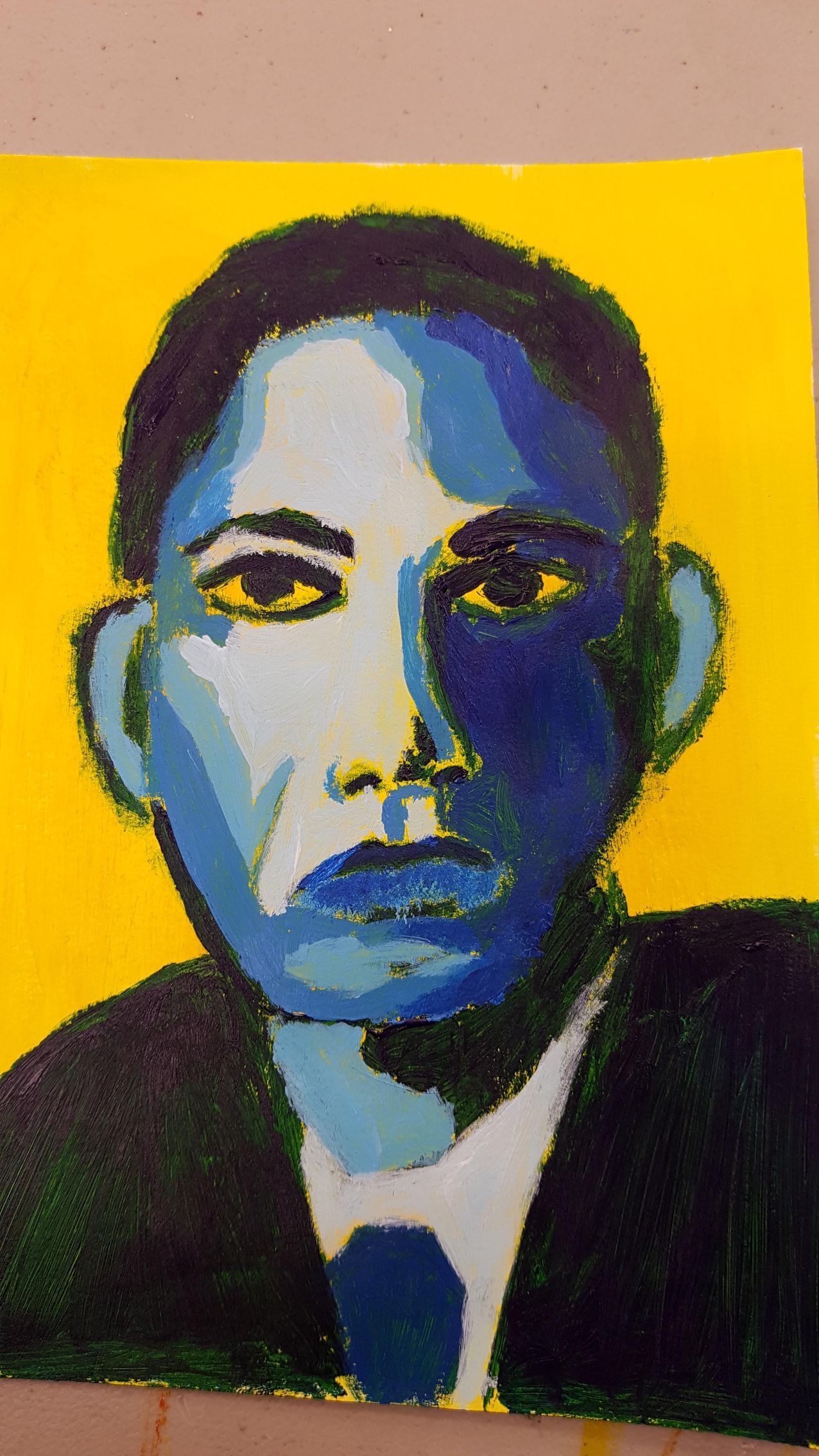 Portrait with a yellow background; face rendered in blue hues, wearing a black suit.