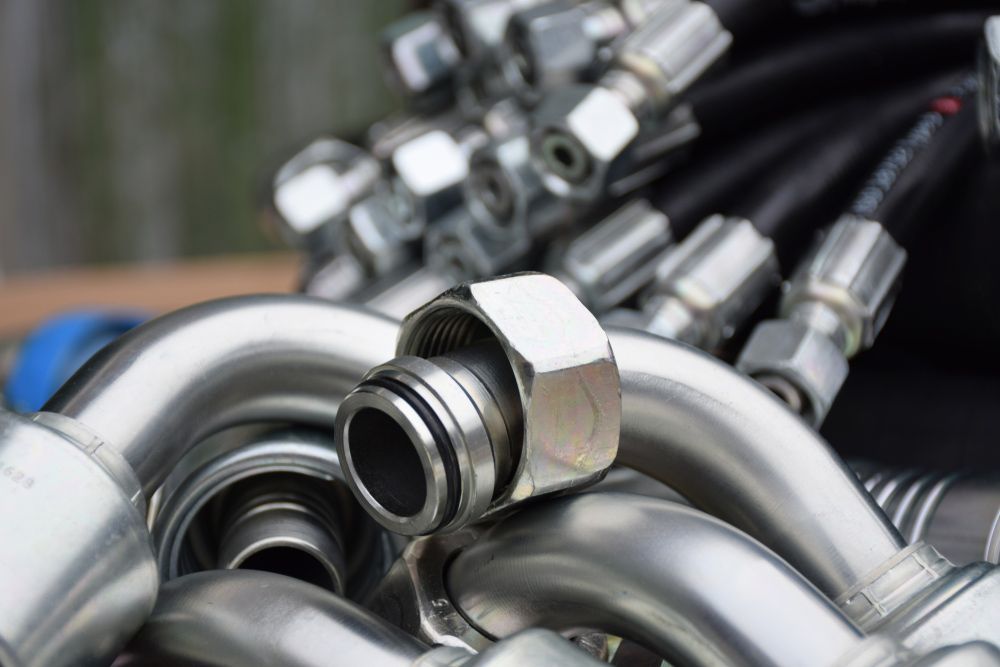 A Bunch of Hydraulic Hoses Are Stacked on Top of Each Other on a Table — Rowdraulics NQ Pty Ltd in Mount Louisa, QLD