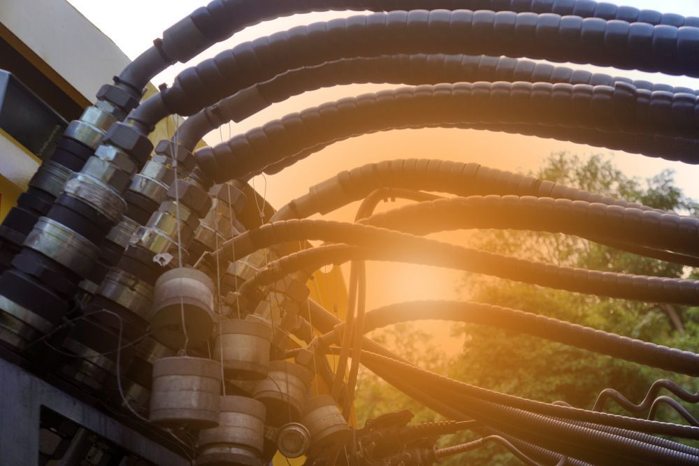 A Bunch of Hydraulic Hoses Are Connected to a Machine — Rowdraulics NQ Pty Ltd in Mount Louisa, QLD