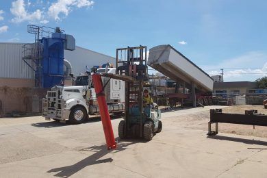 Forklift Is Loading A Semi-Truck In A Parking Lot — Rowdraulics NQ Pty Ltd in Ayr, QLD