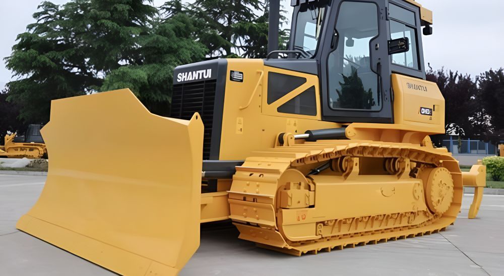 A Yellow Bulldozer is Parked on the Side of the Road — Rowdraulics NQ Pty Ltd in Mount Louisa, QLD