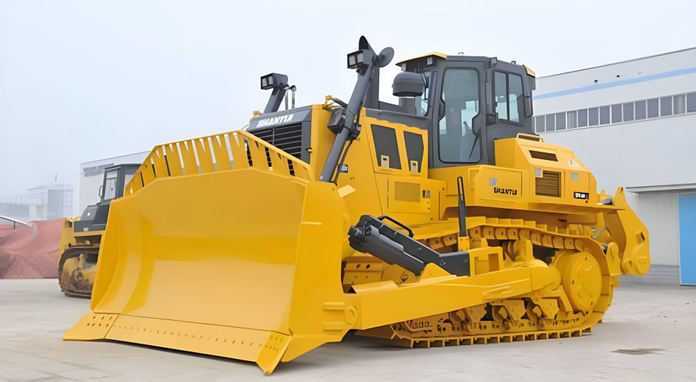 A Yellow Bulldozer is Parked in Front of a Building — Rowdraulics NQ Pty Ltd in Mount Louisa, QLD