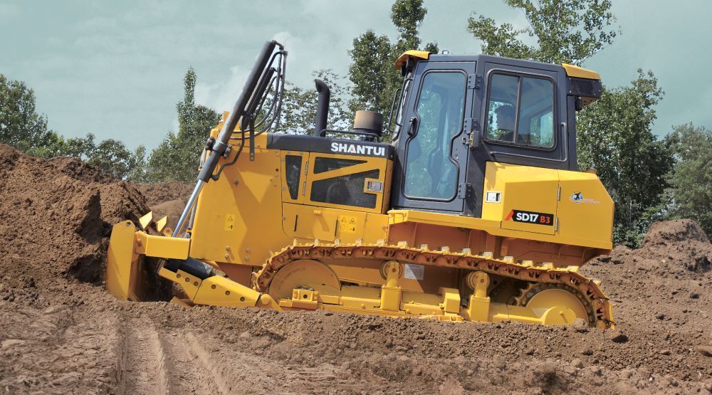 A Yellow Bulldozer is Driving Through a Pile of Dirt — Rowdraulics NQ Pty Ltd in Mount Louisa, QLD