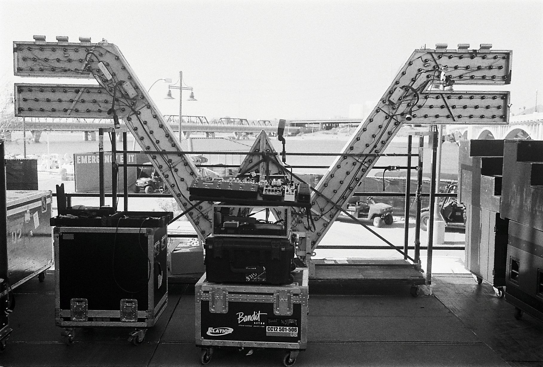A black and white photo of a carnival ride