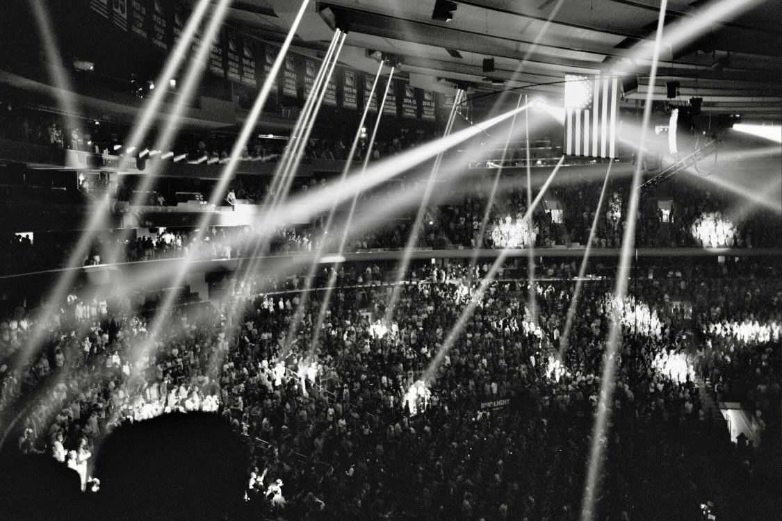A black and white photo of a crowd at a concert