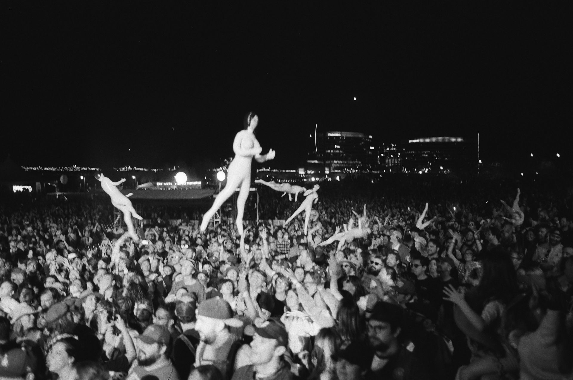 A black and white photo of a crowd of people at a concert.