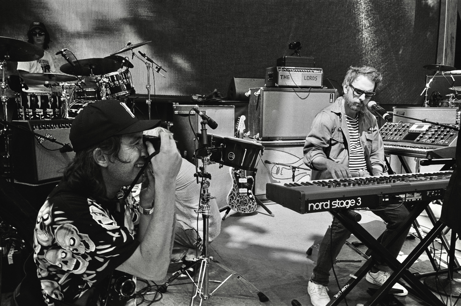 Behind the scenes photo of C-Roll Productions filming Charlie Day performing on stage with Portugal. the Man