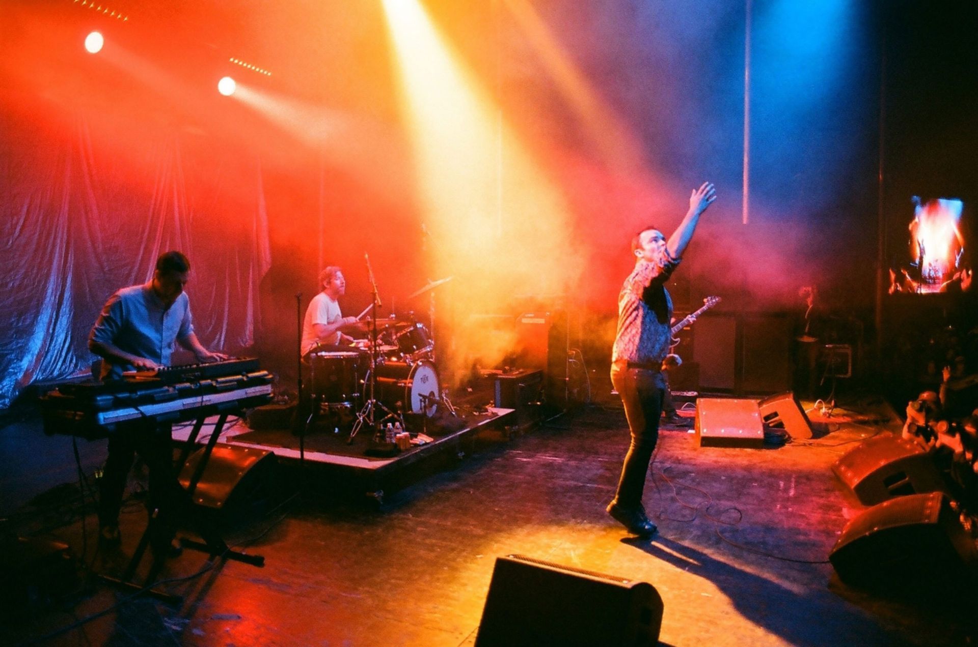A group of people are playing instruments on a stage.