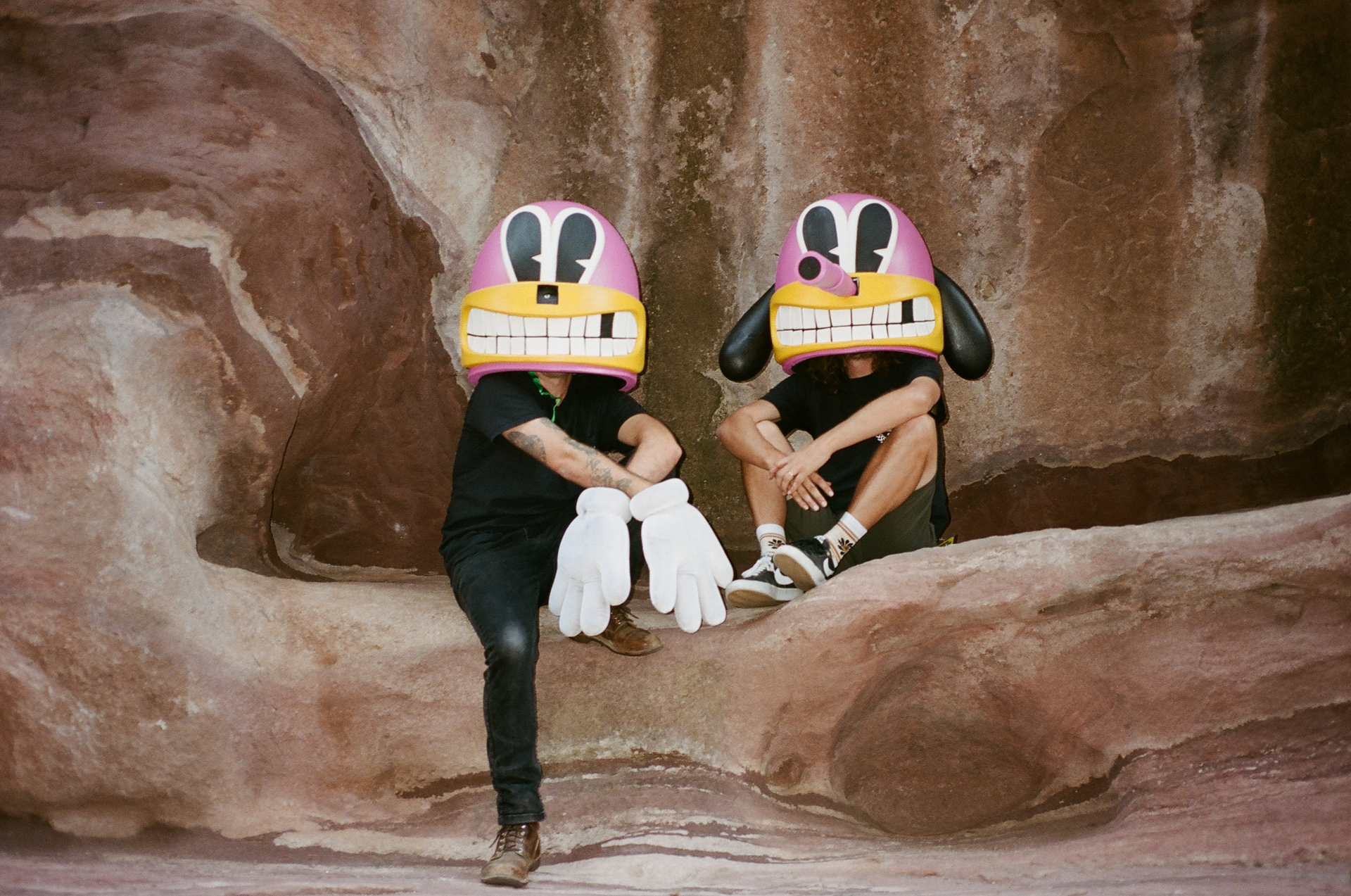 Photo of Rahm & C.J. backstage at Red Rocks Amphitheater wearing props used by the band Portugal. the Man