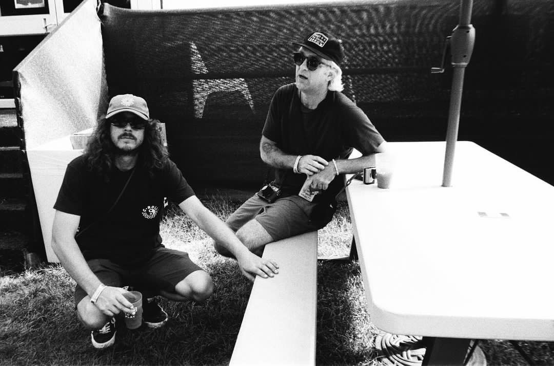 Founders of C-Roll Productions, C.J. & Rahm, taking a break backstage during a concert