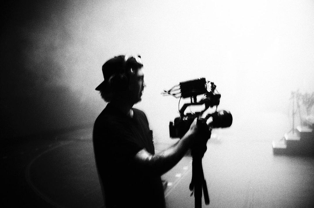 Photo of Rahm, filming backstage at a concert for C-Roll Productions
