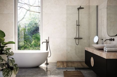 Luxury bathroom renovation with modern fixtures, elegant tile design, and custom vanity by Do-All Group.