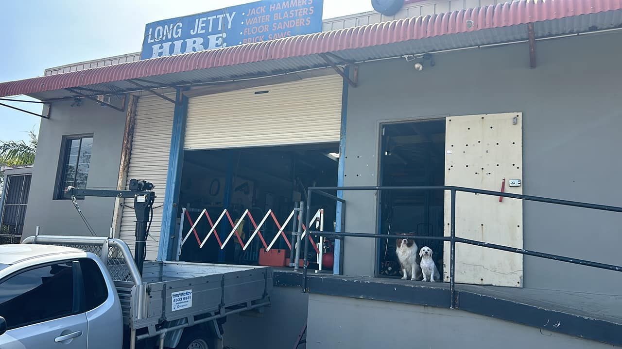 A Truck Is Parked In Front Of A Building With A Sign That Says Long Jetty Hire – Central Coast, NSW - Long Jetty Hire