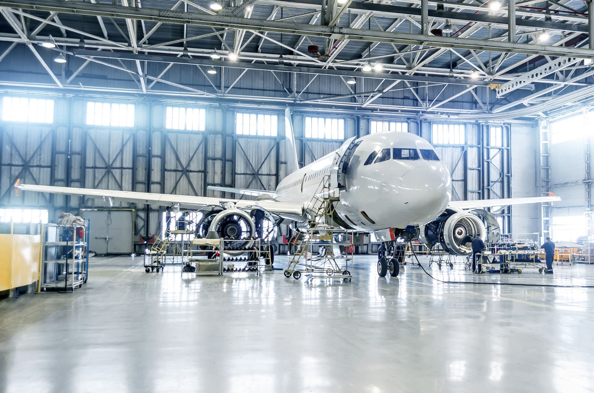 An airplane hangar with a coated concrete floor