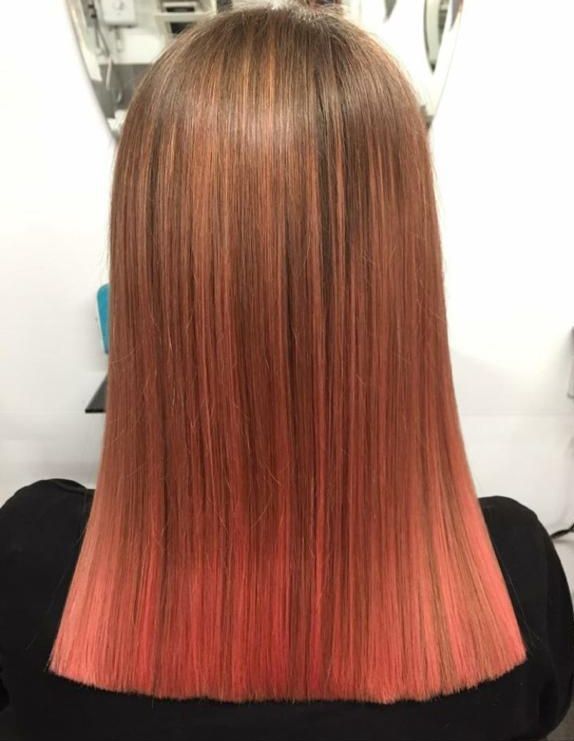 a girl with red hair dye in toddingdon hair salon