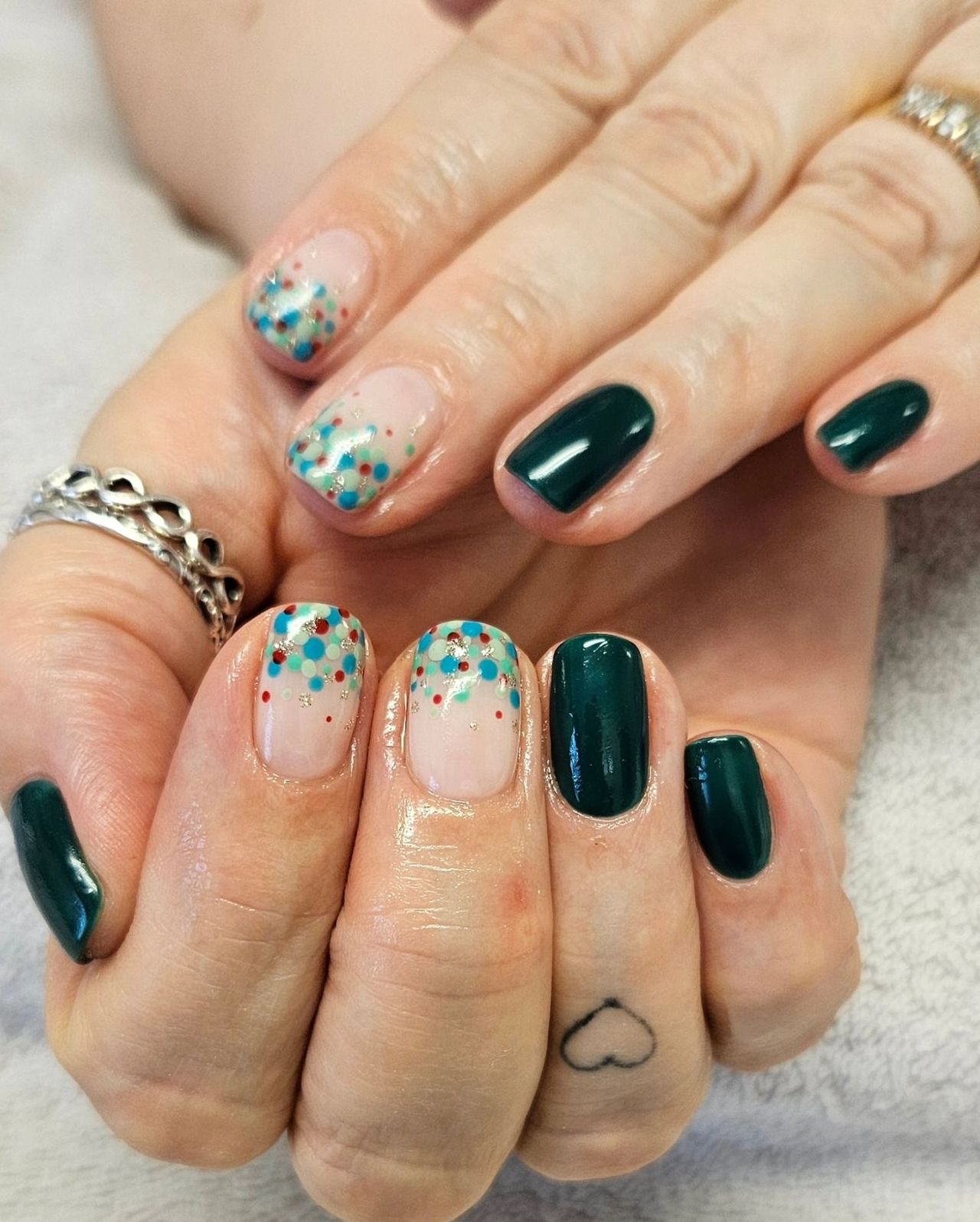 A woman with green gel nails manicure