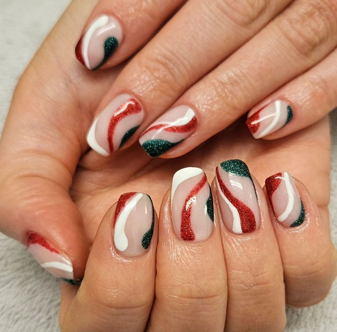 Woman with gel nail extensions and nail art 