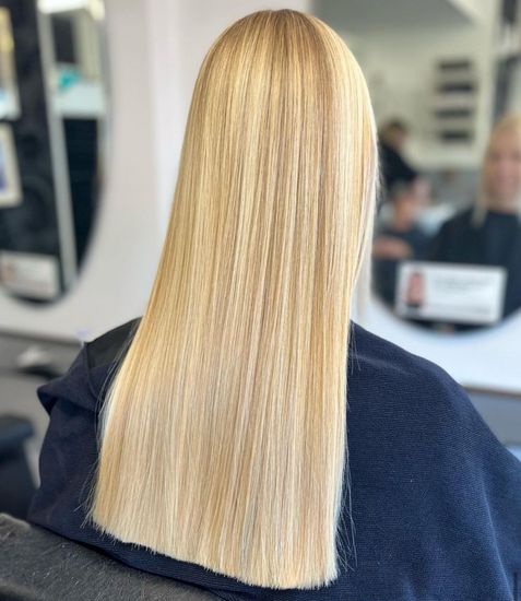 Straight blonde haircut styled at Panache Hair and Beauty, featuring sleek, precision-cut ends for a smooth and polished look