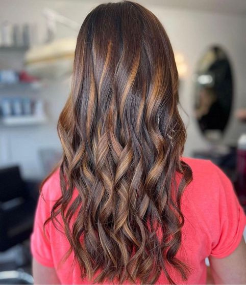 A beautifully blended balayage with warm caramel tones, created by our expert stylist for a soft and natural autumn-ready look.