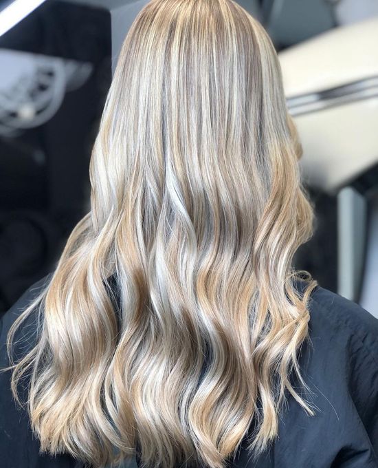 Straight blonde haircut styled at Panache Hair and Beauty, featuring sleek, precision-cut ends for a smooth and polished look