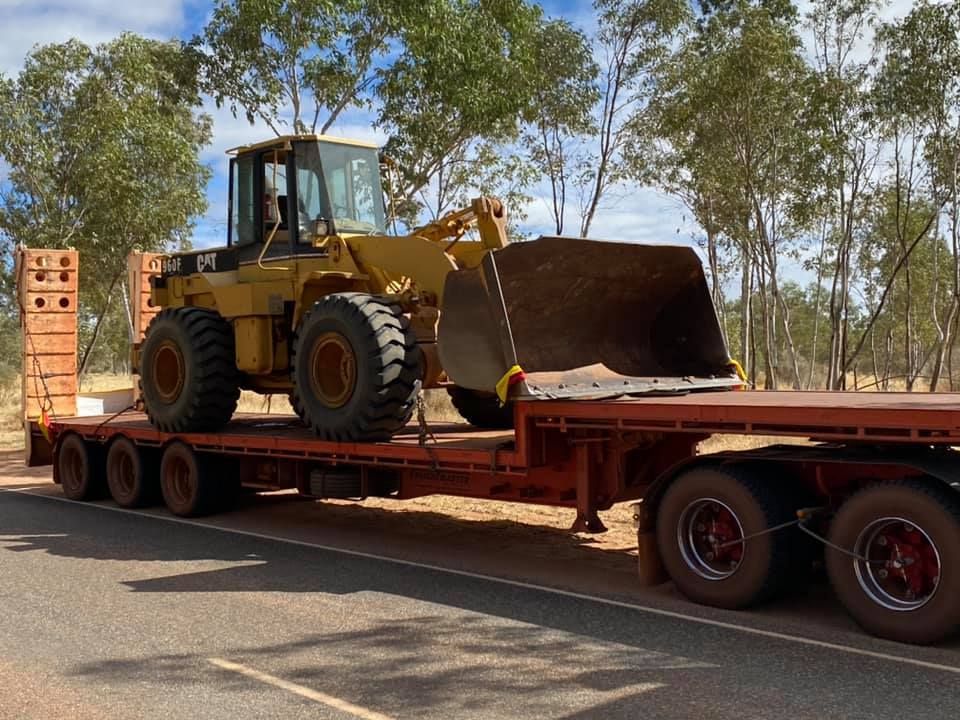 A Bulldozer Is Sitting On Top Of A Flatbed Trailer — Territory Towing & Transport In Alice Springs, NT