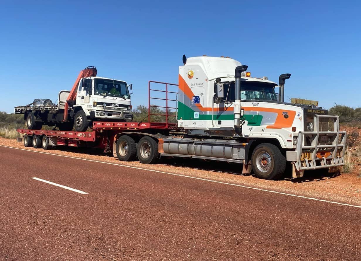 Two Semi Trucks Are Parked On The Side Of The Road — Territory Towing & Transport In Alice Springs, NT