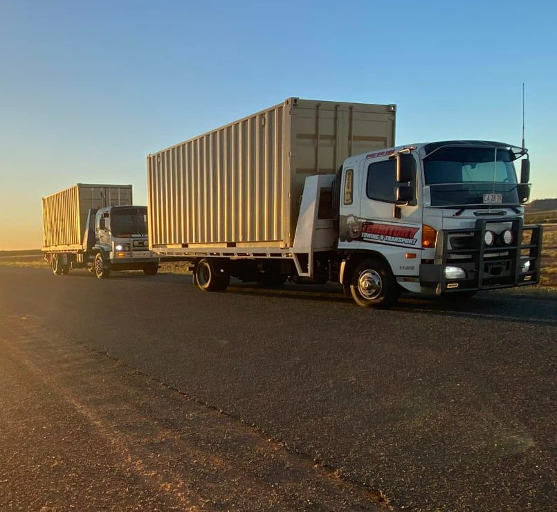 Two Trucks Are Parked Next To Each Other On The Side Of The Road — Territory Towing & Transport In Alice Springs, NT