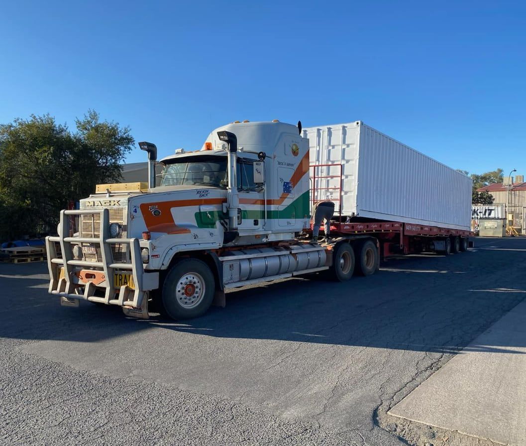 A Semi Truck With A Trailer Is Parked On The Side Of The Road — Territory Towing & Transport In Alice Springs, NT