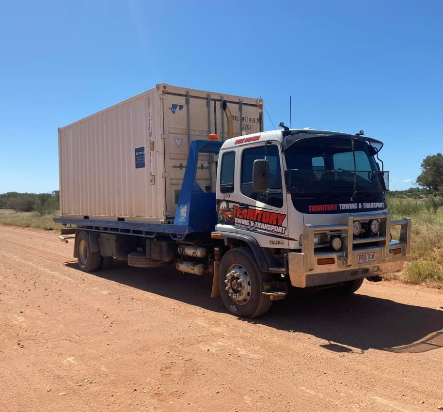 A Tow Truck Is Parked On The Side Of A Dirt Road — Territory Towing & Transport In Alice Springs, NT