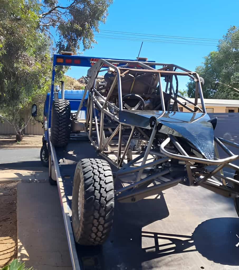 A Buggy Is Being Towed By A Tow Truck — Territory Towing & Transport In Alice Springs, NT