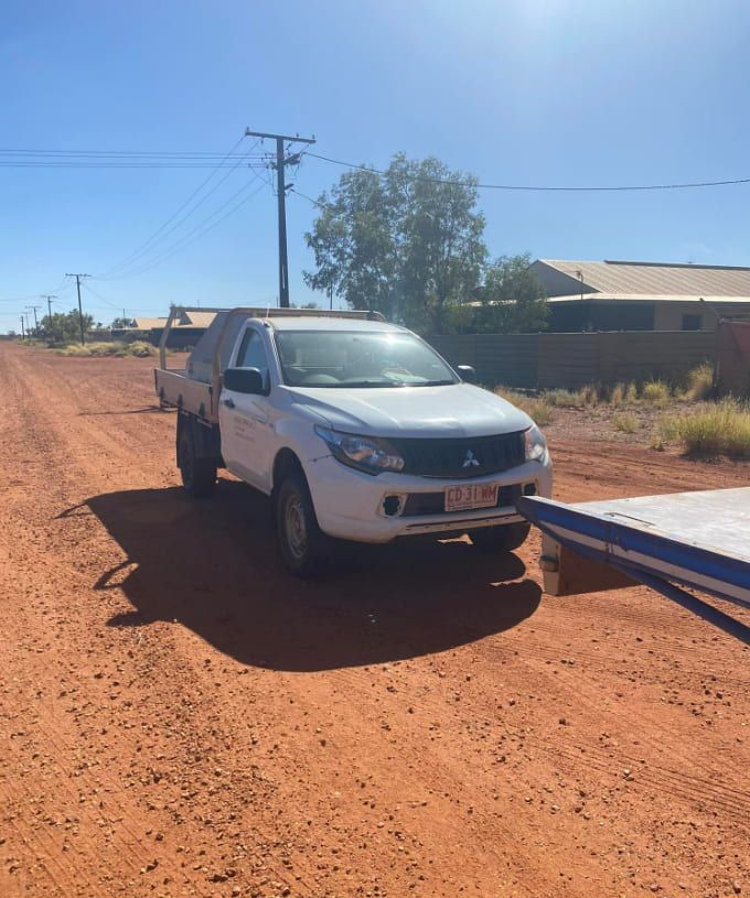 A White Truck Is Parked On The Side Of A Dirt Road — Territory Towing & Transport In Alice Springs, NT