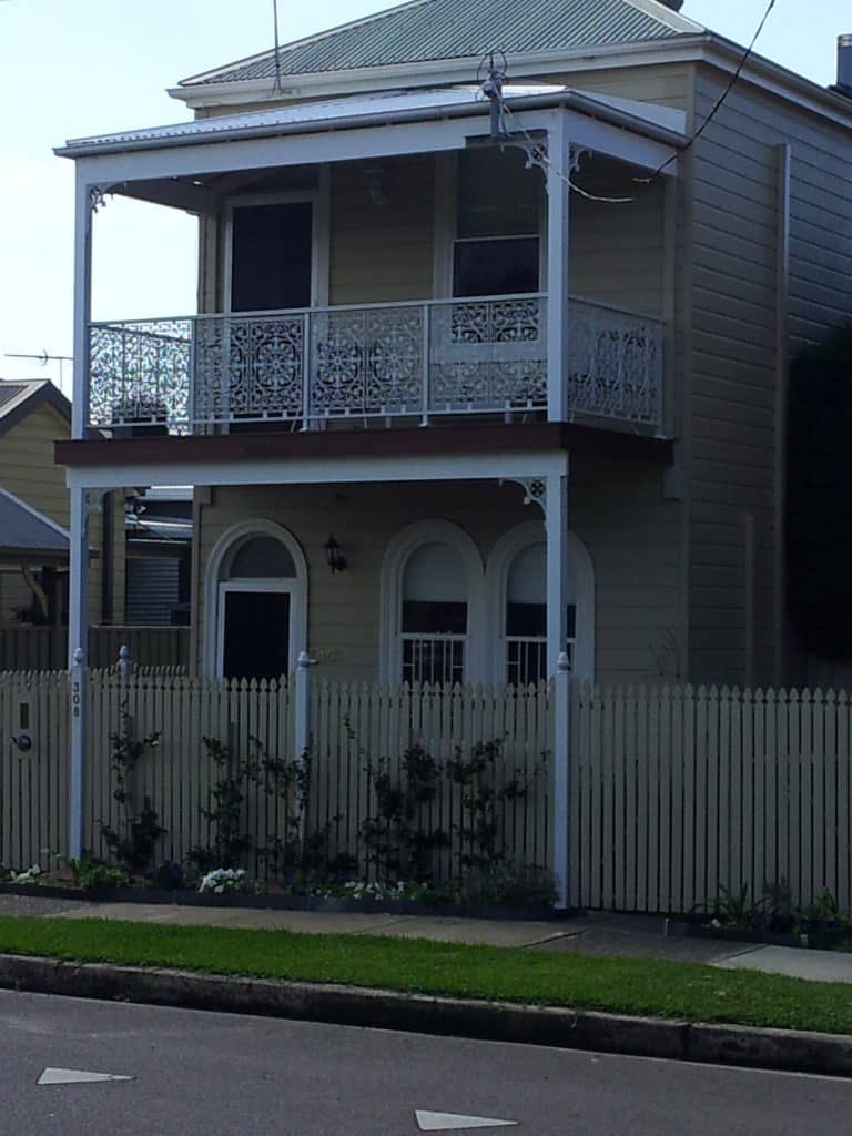 A White Decorative Balustrade And Wooden Spear Fence - Balustrade in Maitland, NSW