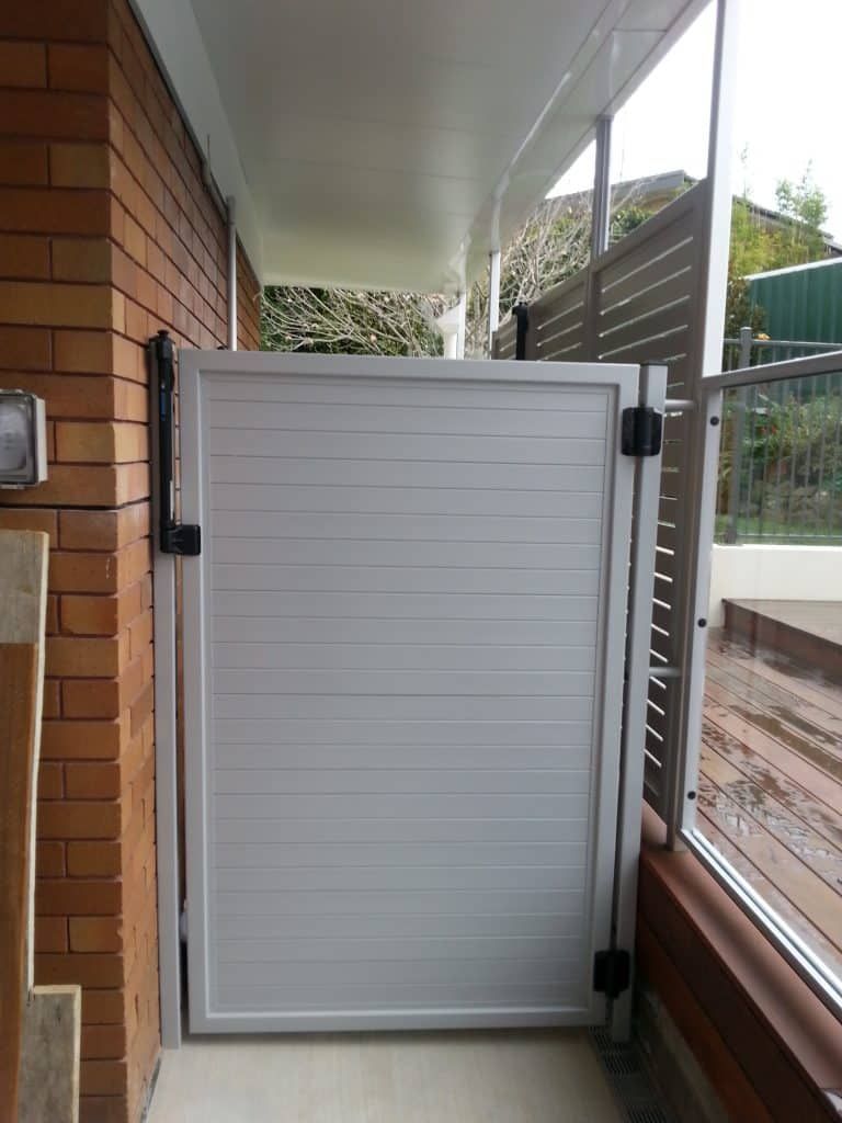 Grey Single Gate With Brick Wall - Aluminium Manufacturer in Newcastle, NSW