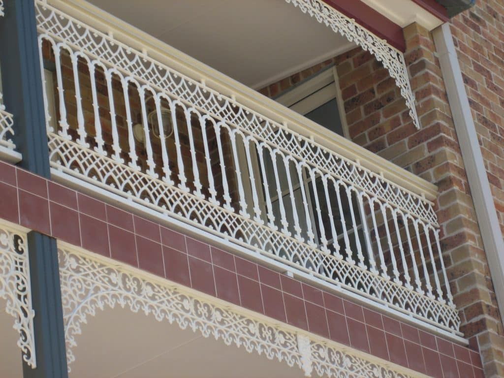 An Ornate Balcony With Wrought Iron Railings - Balustrade in Lake Macquarie, NSW