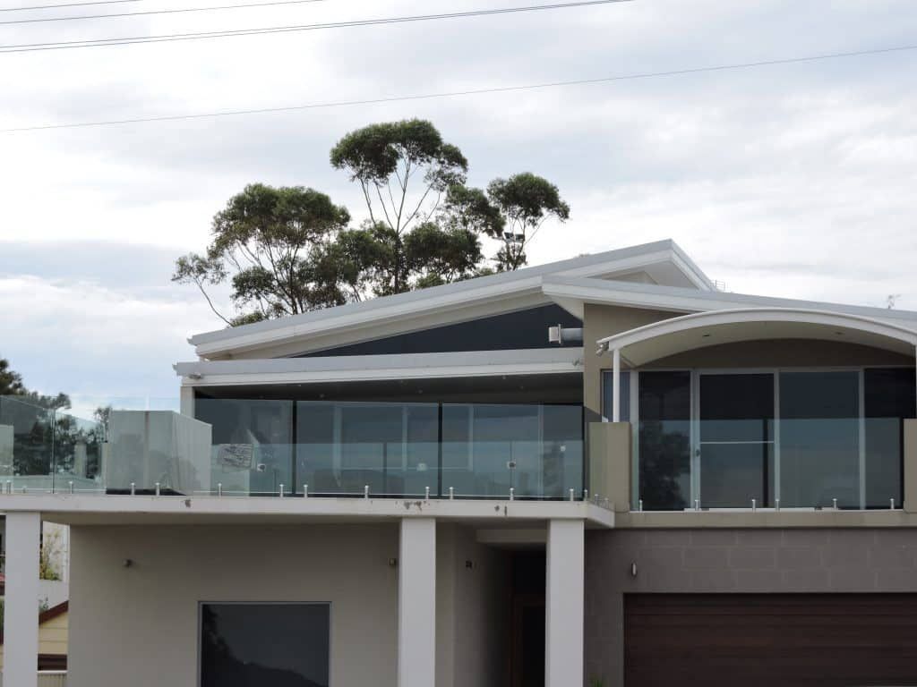A Large House With Frameless Glass Balustrades
