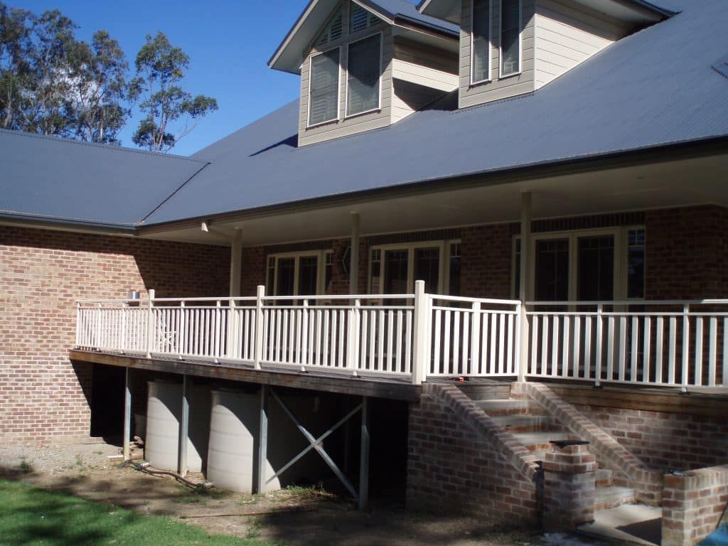 A Brick Residence With White Railings - Balustrade in Lake Macquarie, NSW