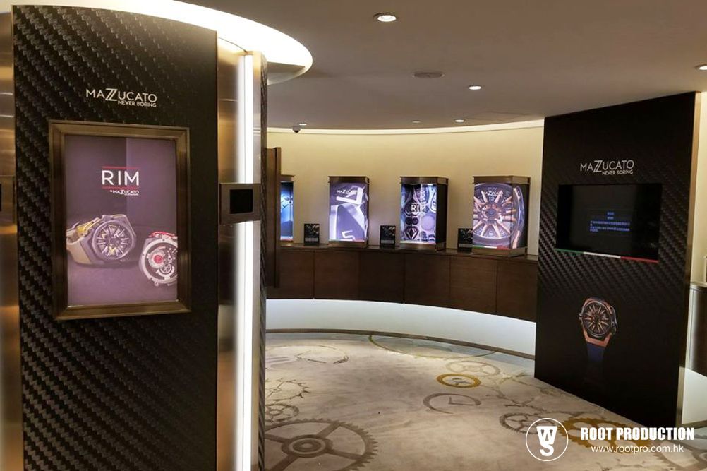 Luxury watch store interior with watch displays. Dark walls with gold accents and circular layout.