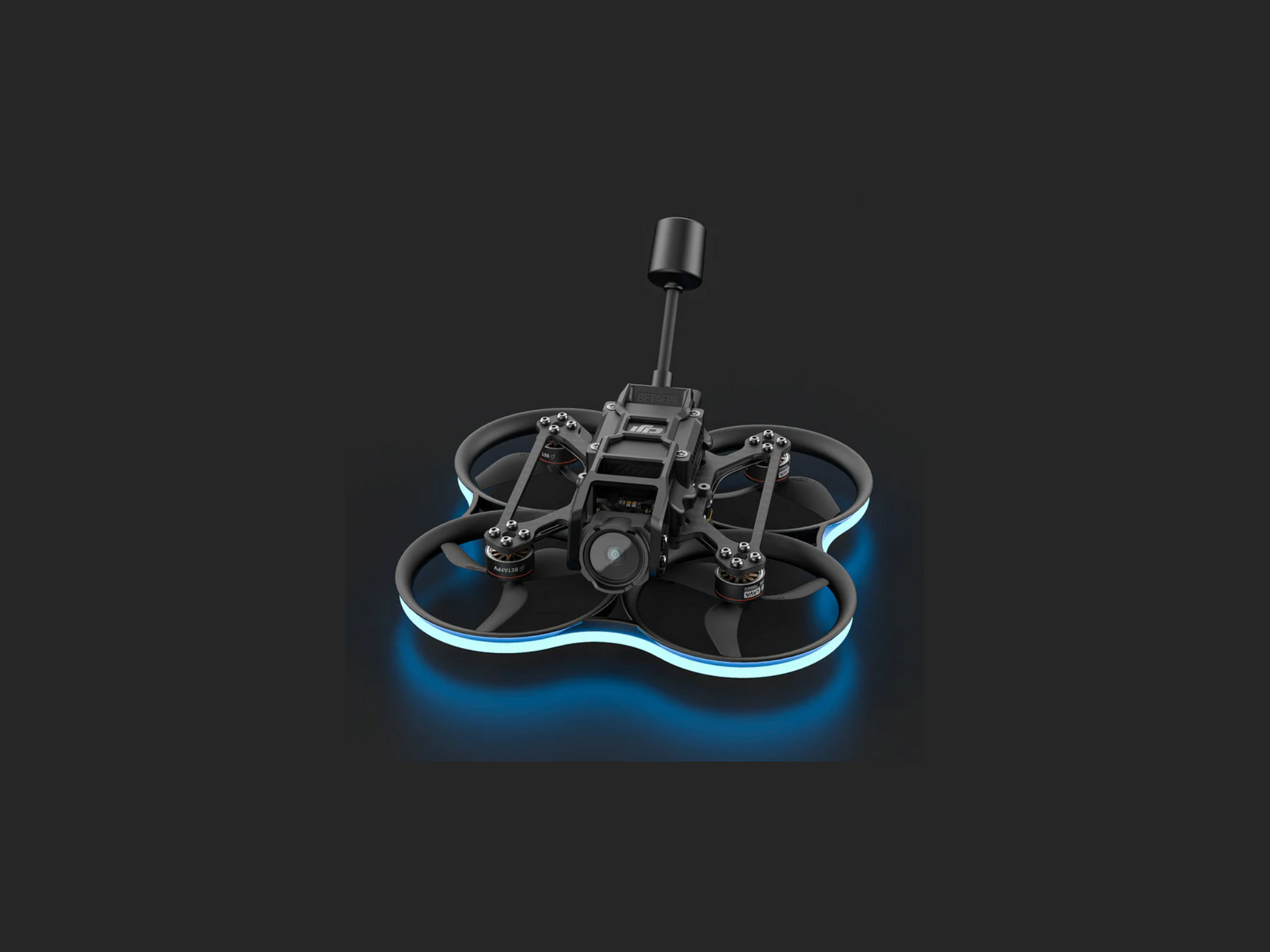 A drone is sitting on top of a black surface.