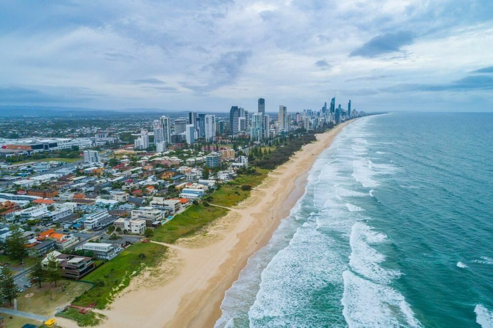 An Aerial View of a Beach With a City in the Background — Poljak Plasterers in Hermit Park, QLD