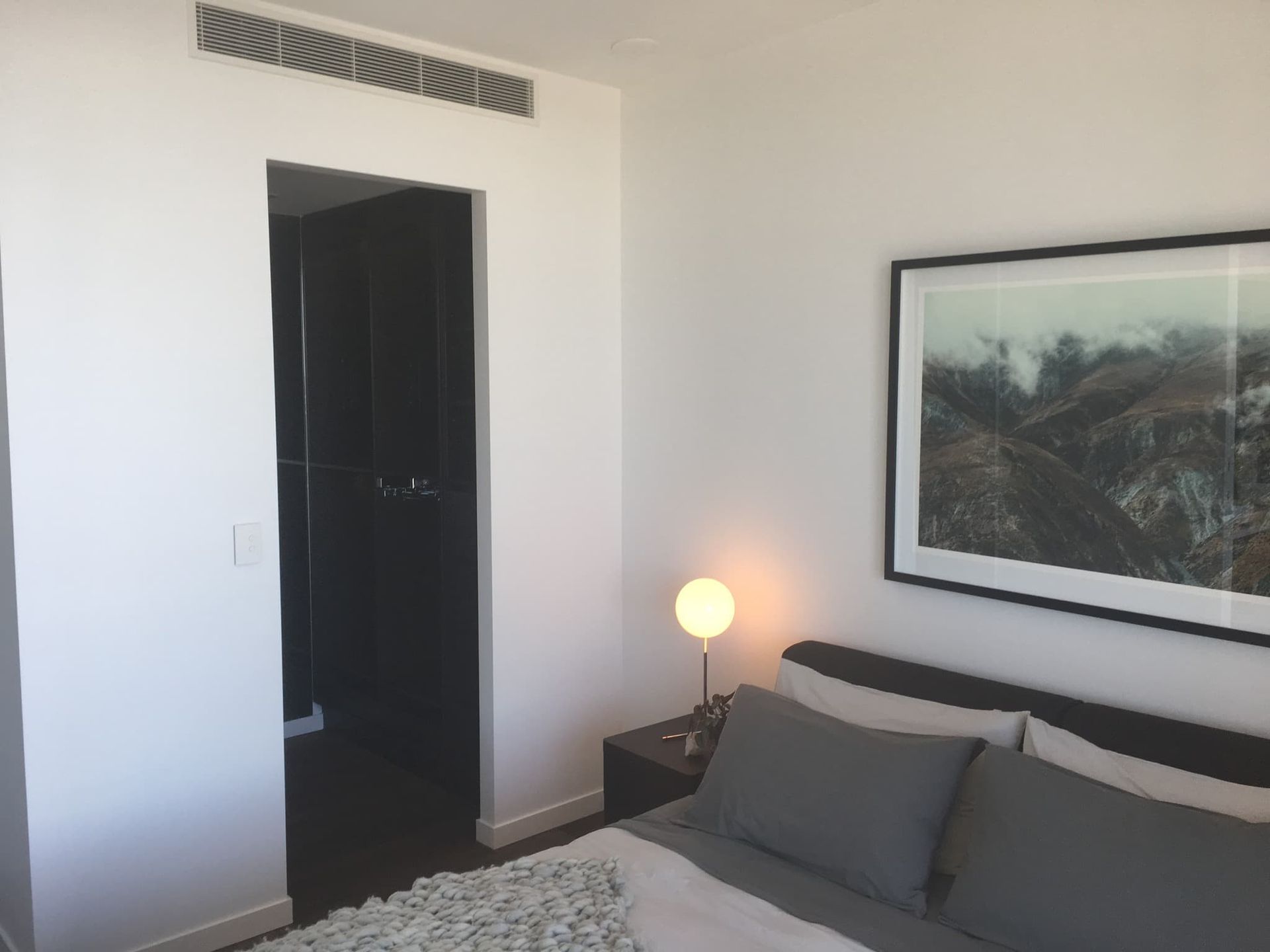 A Bedroom With a Bed and a Picture on the Wall  — Poljak Plasterers in Railway Estate, QLD