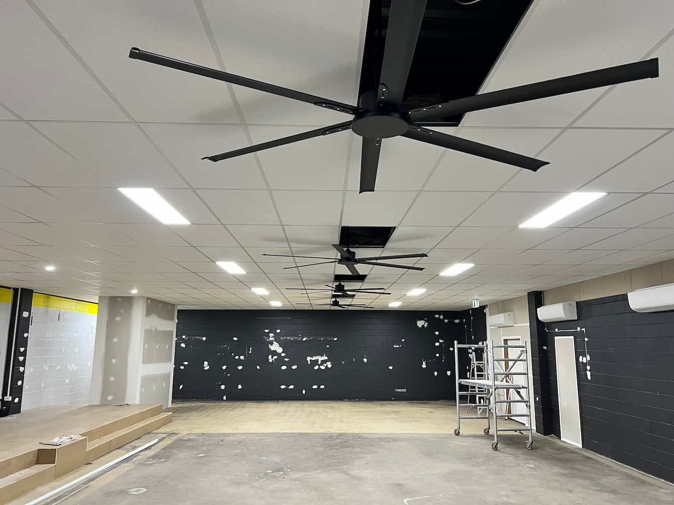 A Large Room With a Ceiling Fan Hanging From the Ceiling — Poljak Plasterers in Oonoonba, QLD
