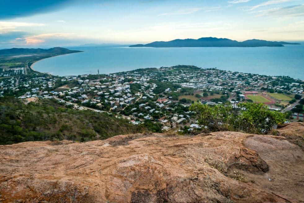 A View of a City From a Rocky Cliff Overlooking the Ocean — Poljak Plasterers in Townsville City, QLD